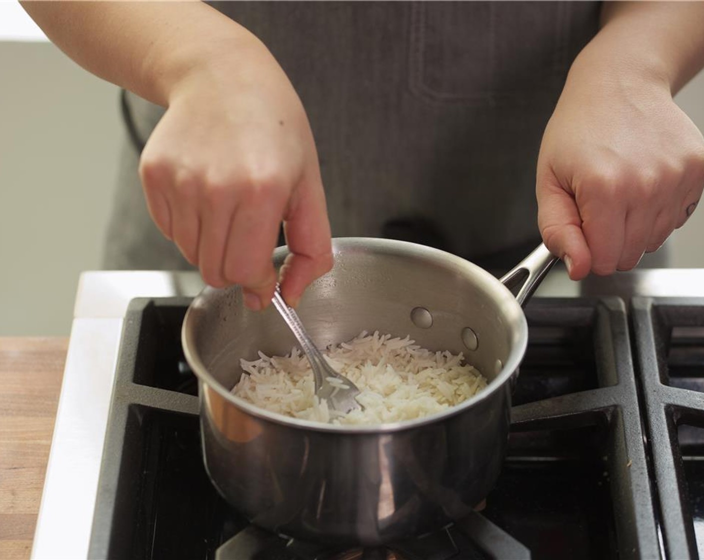 step 4 In a medium saucepan, add one cup of water and the Basmati Rice (2/3 cup) and bring to a boil over medium-high heat. Stir once, then cover and reduce heat to low and simmer for 10 minutes. Remove from heat, fluff rice, and hold until plating.