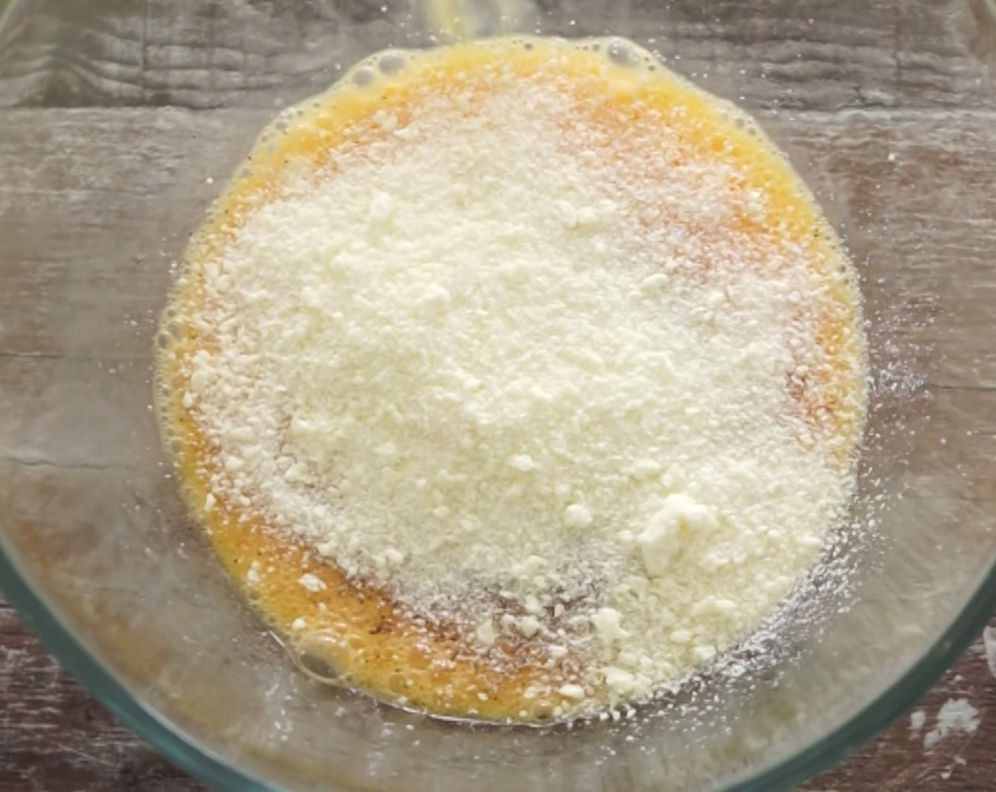 step 8 Next, grab a mixing bowl and add Eggland's Best Organic Eggs (Brown) (6), Ground Black Pepper (to taste), and Pecorino Romano Cheese (1 2/3 cups). Combine these ingredients really well before adding the cooked guanciale and mixing this through too.