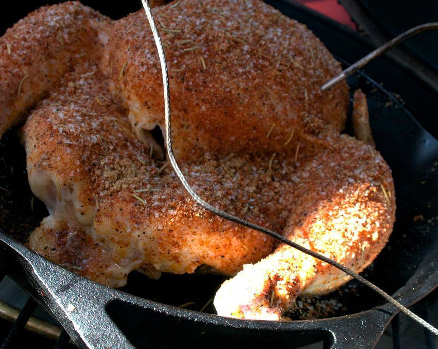 step 6 Place the chicken in a cast iron skillet and smoke between 225 and 250 degrees F for 3.5 to 4 hours, until breast meat reaches 165 degrees F.