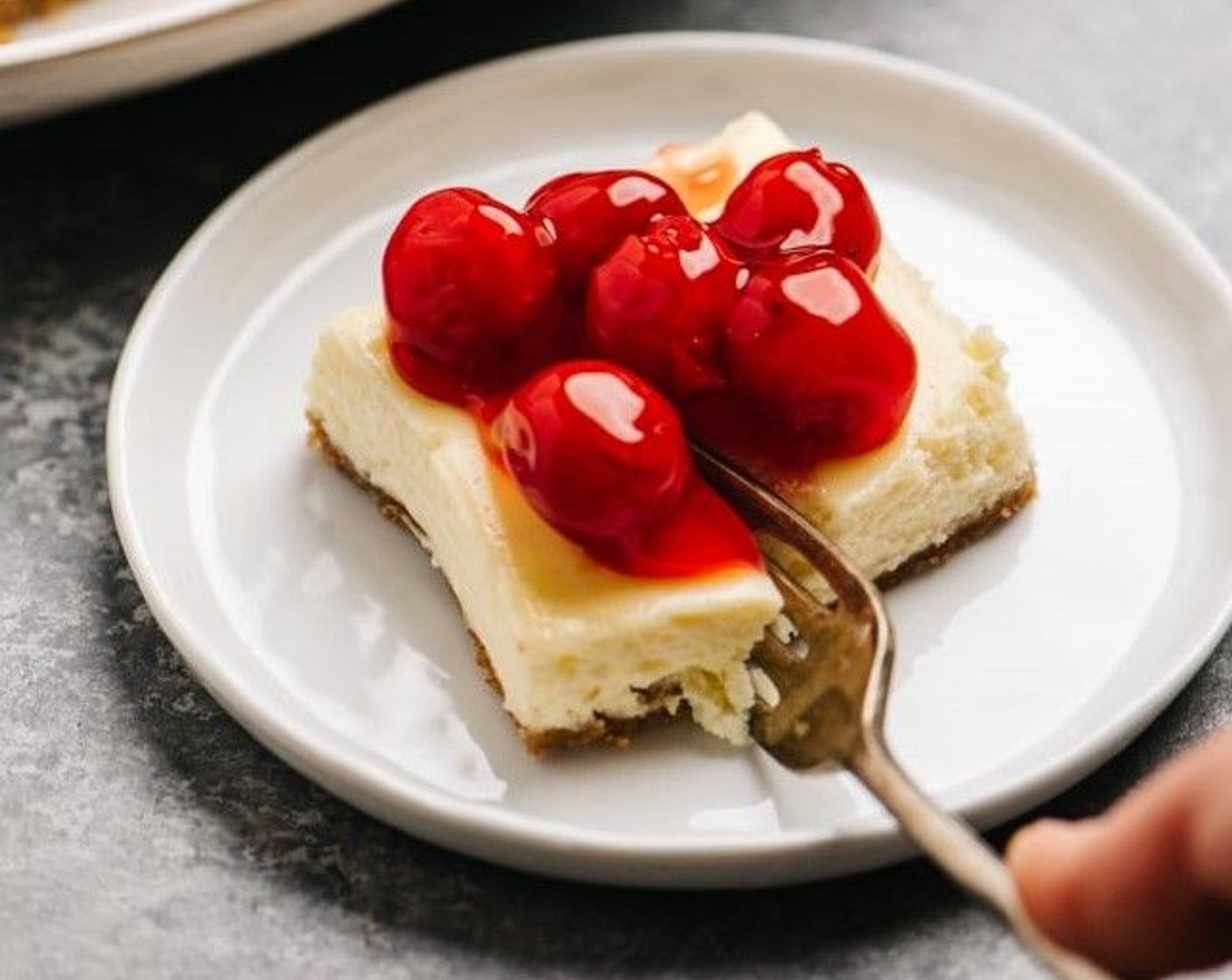 step 10 To serve, use a large, sharp knife to cut into squares. I recommend wiping the knife clean with a damp cloth between slices. Serve with a dollop of Cherry Pie Filling (1 can) or fresh fruit and enjoy!