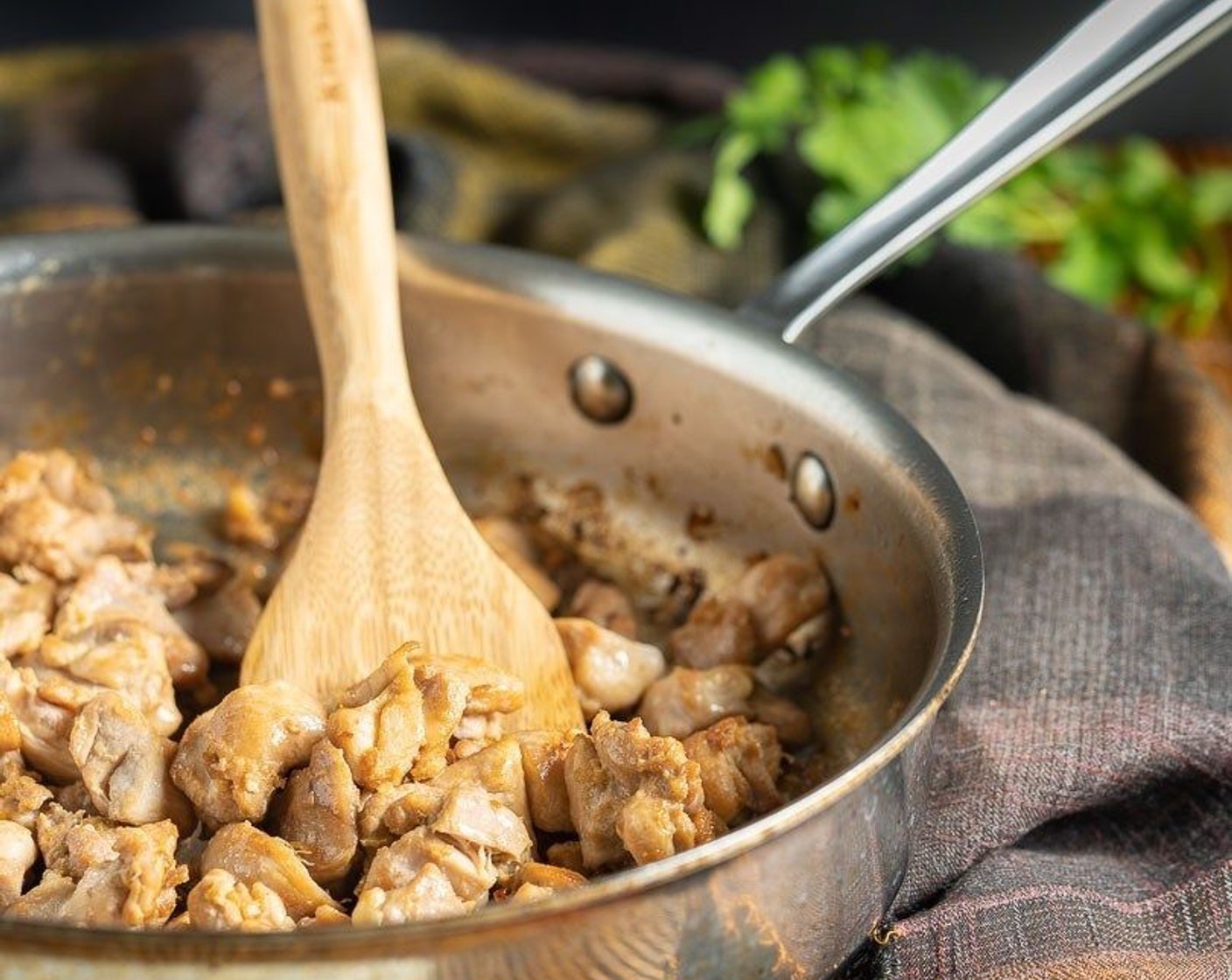 step 6 Meanwhile, heat remaining Oil (1 Tbsp) over medium-high heat in a wok or large skillet. Add chicken slices and cook until lightly browned and cooked through, tossing occasionally for about 6 minutes.