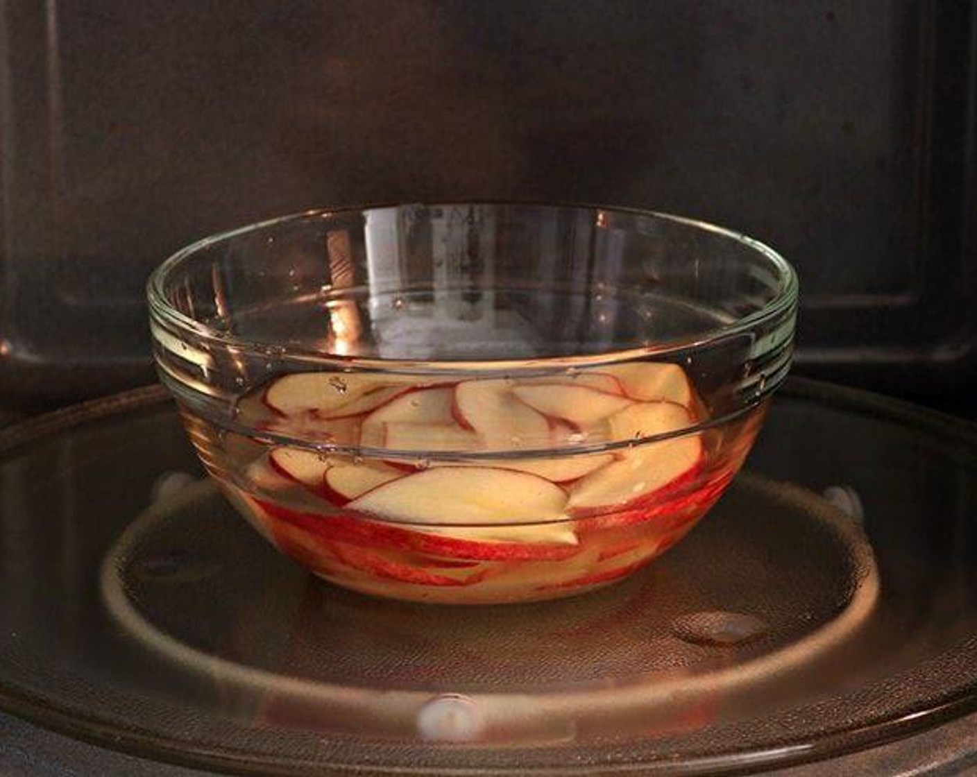 step 3 Place the sliced apples into the bowl of lemon water. Microwave, about 1-2 minutes until the apples are pliable, soft but not mushy. Reserve 1 tablespoon apple liquid to grated apple.