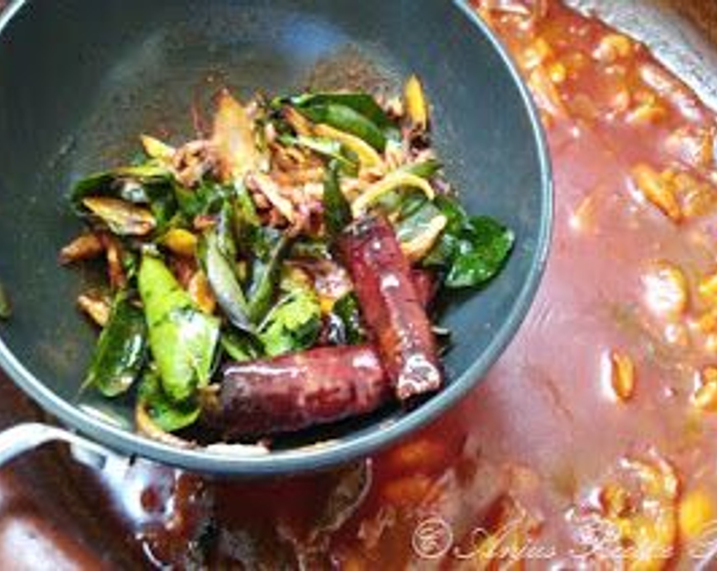 step 8 Sauté for another minute and pour it to the curry. Mix well, then cover for 5 minutes so the flavors can meld.