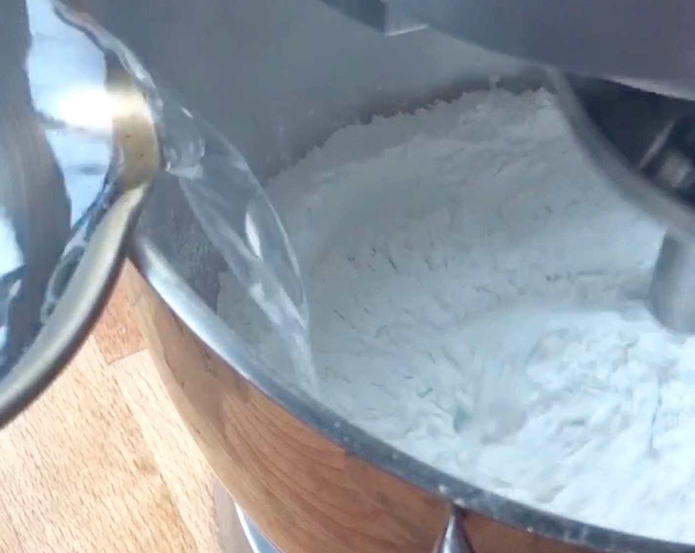 step 10 Quickly add in the boiling water and using a dough hook, stir until the flour mixture comes together.