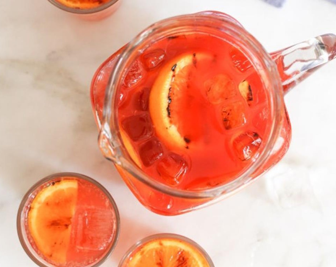 step 4 Garnish each glass with a grilled orange slices and drink up! Enjoy!