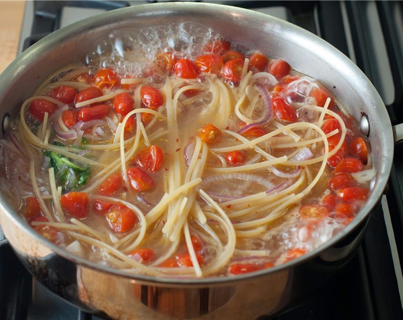 step 3 Once boiling, cook for 9 minutes. Using tongs, occasionally lift and move the pasta so that it doesn’t stick to the bottom of the pan. Then turn off the heat.