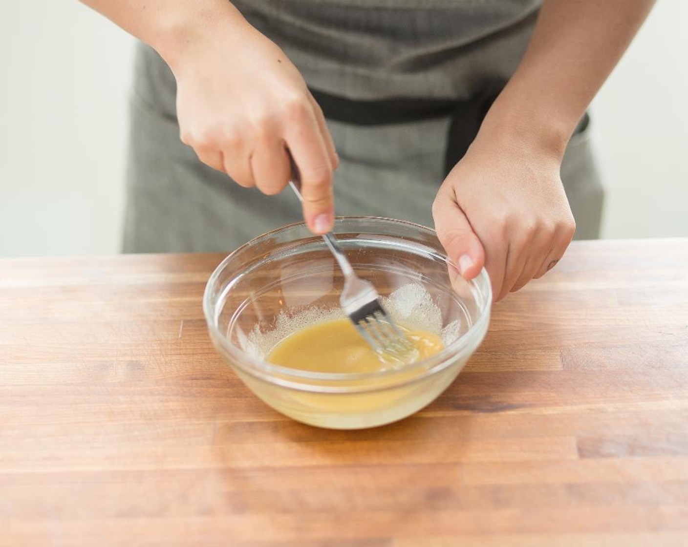 step 5 To the bowl with the lemon juice, add the Dijon Mustard (2 pckg), Olive Oil (1 Tbsp), Maple Syrup (1 Tbsp), and Salt (1/4 tsp). Whisk all ingredients together and hold.