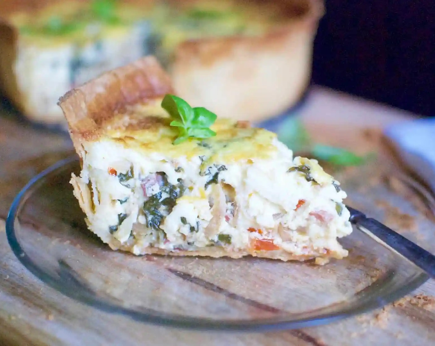 step 19 Garnish with Fresh Basil Leaves (to taste) if desired. Cut the quiche into wedges and serve while still warm.