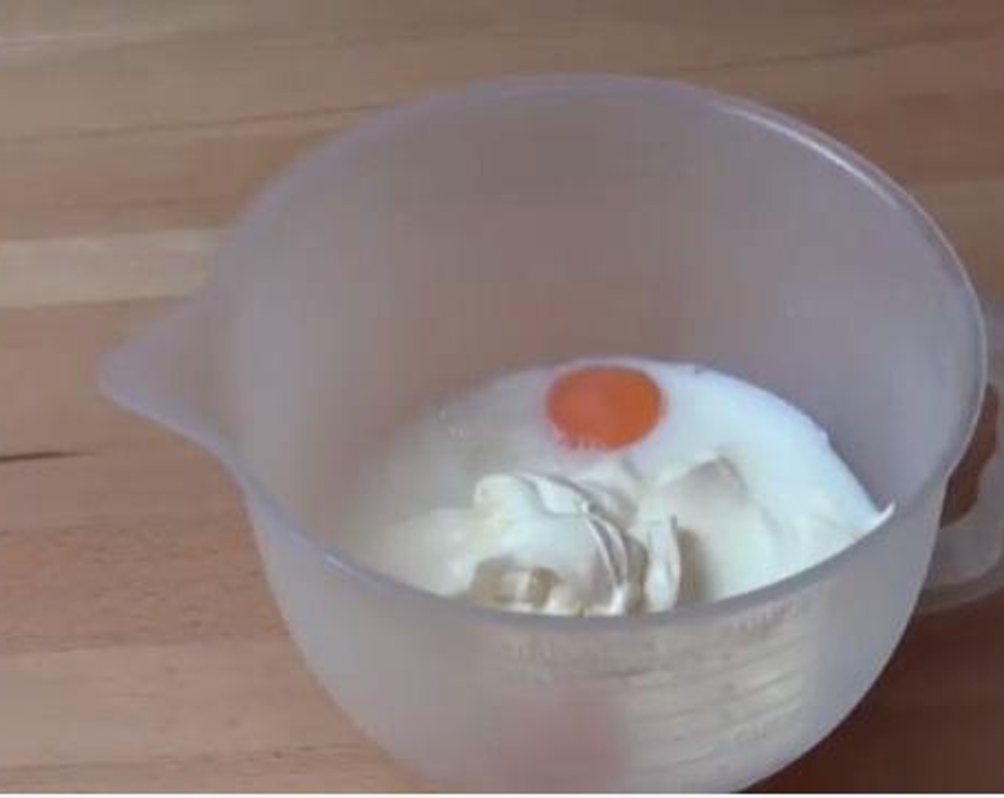 step 3 Inside a mug, whisk together your Eggs (2), Milk (1/3 cup), and Sour Cream (1 cup).