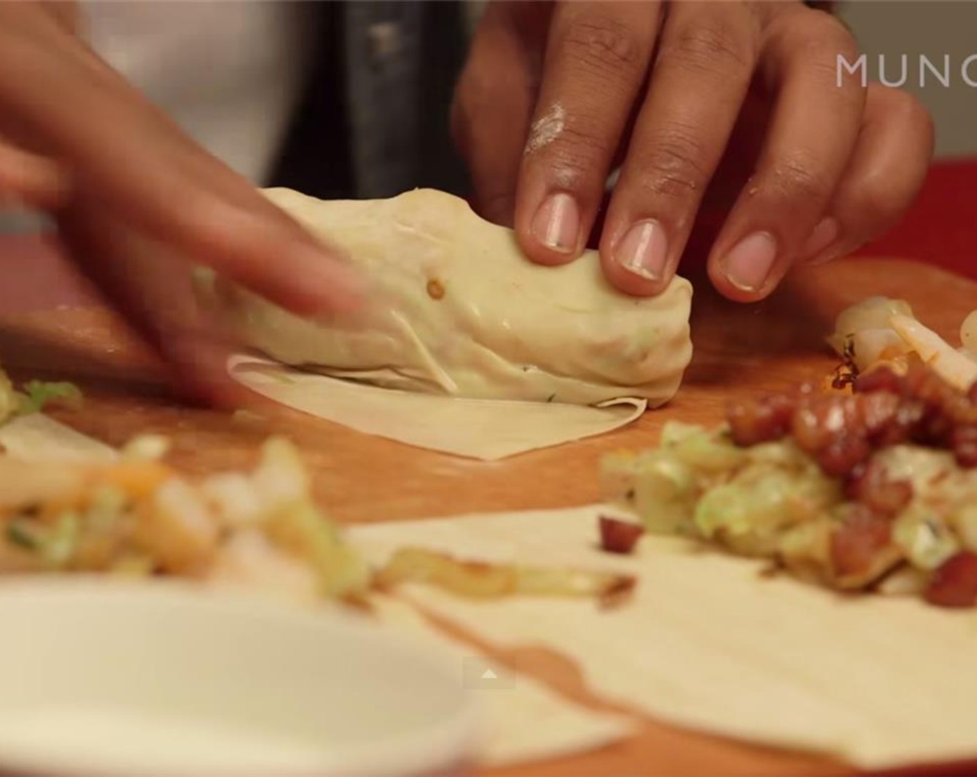 step 12 Seal the roll off with Water (to taste). Use your fingertip by dipping into water. Set aside.