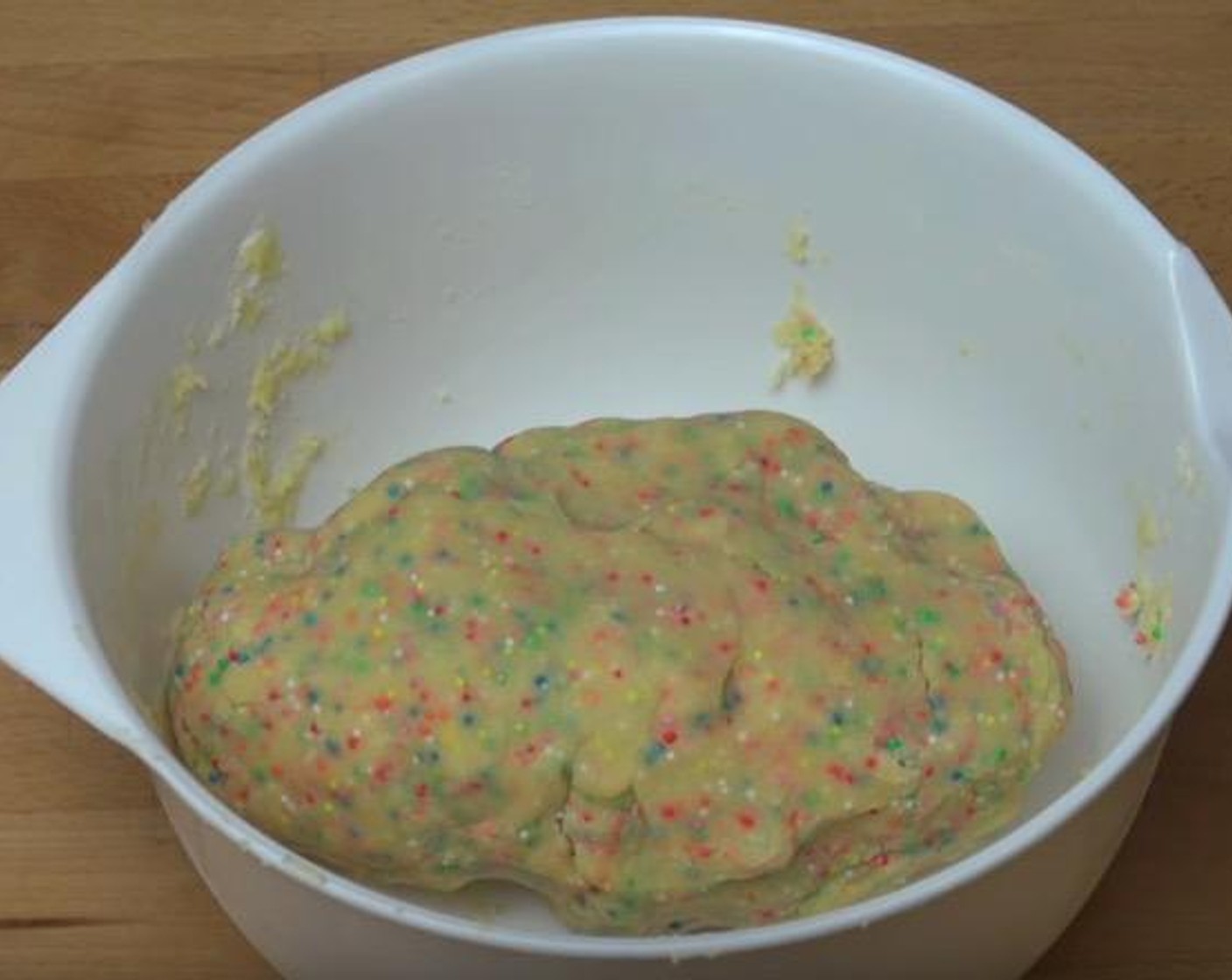 step 3 Sift in All-Purpose Flour (2 cups) and add Sprinkles (1/2 cup). With a spoon, gently mix together until everything is combined.