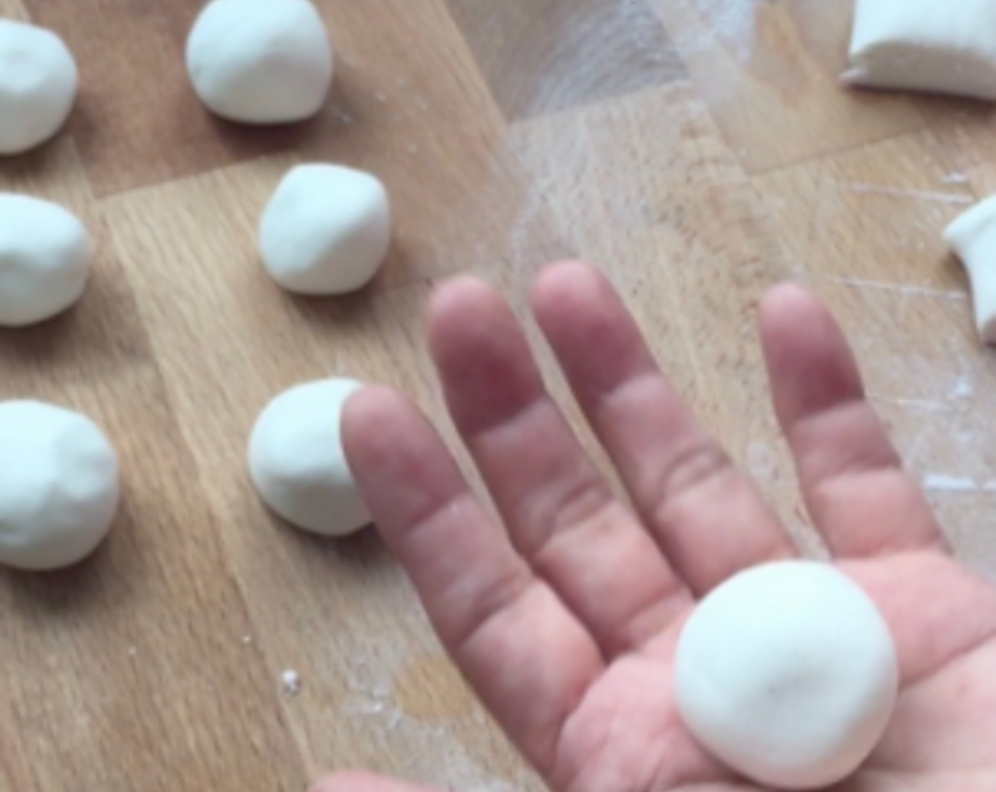 step 19 Using our palms, roll each piece of dough into a ball. Repeat the same with the other half of the dough.