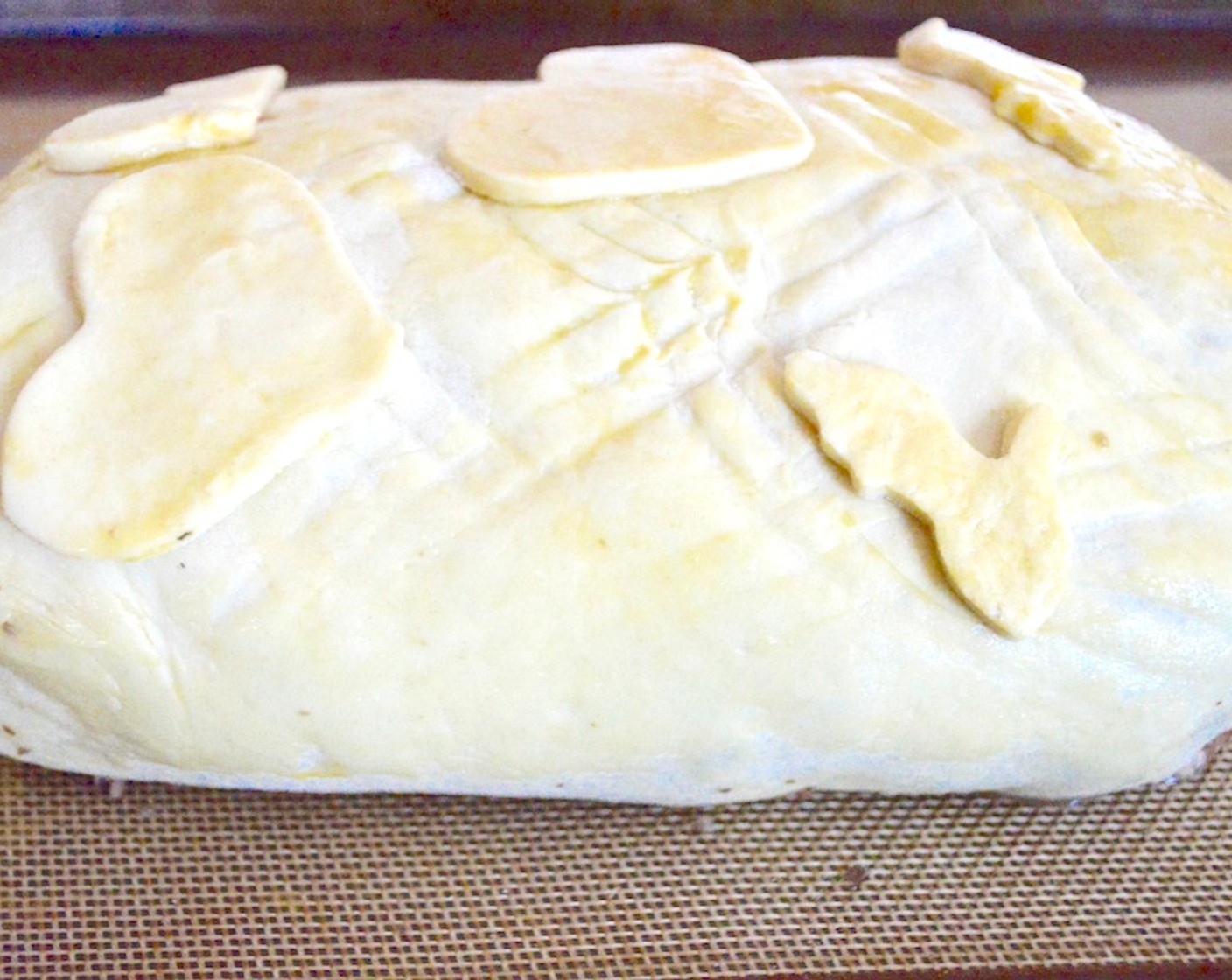 step 10 Use a fork to gently score lined patterns in the dough if you wish, and use the second sheet of puff pastry to cut out any shapes you like. This is all optional. If you do cut out shapes to decorate, place them on the beef wellington and gently press them into the puff pastry dough.