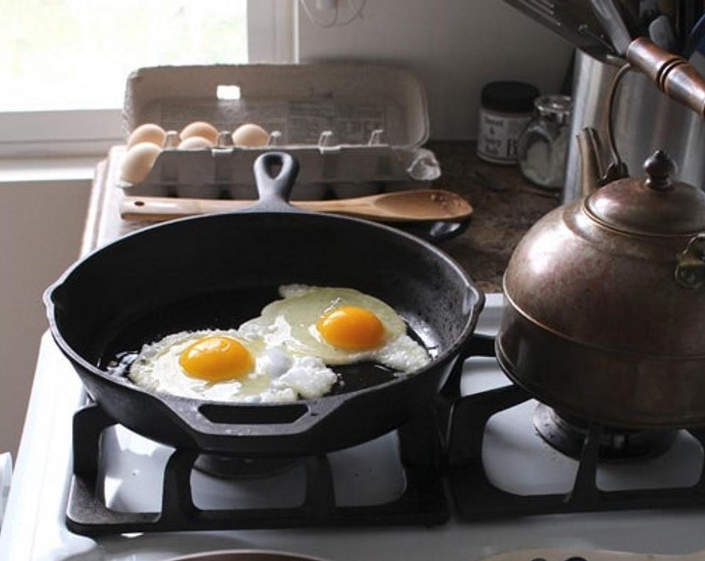 step 2 Heat a skillet over medium-high, add Olive Oil (1 tsp), then Eggs (2). Cook until done, flipping if desired. Season with Salt (1 pinch).