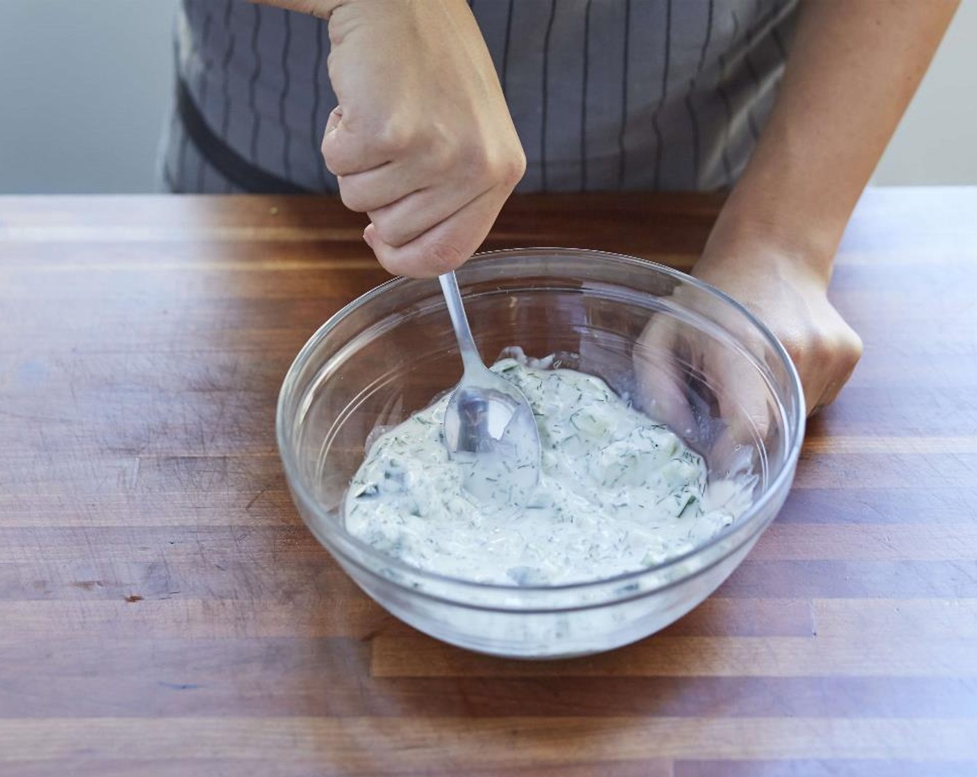 step 7 To the bowl with the cucumber mixture, stir in the Greek Yogurt (2/3 cup), White Wine Vinegar (2 Tbsp), Salt (1/4 tsp) and Ground Black Pepper (1/4 tsp) until all ingredients are combined. Refrigerate until ready to use.