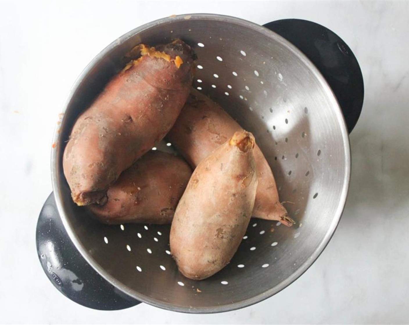 step 2 Cover with plenty of water. Bring to a boil, then lower to a simmer. Simmer for 50 minutes to an hour until the potatoes are completely tender.