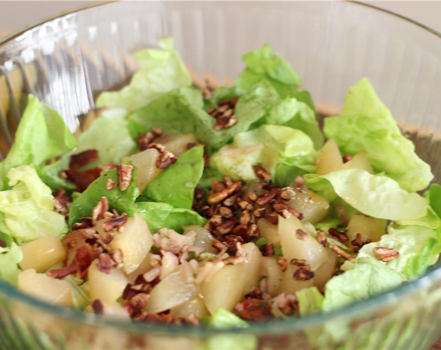 step 13 Combine butter lettuce, bacon, pecans, and pears in a large bowl. Toss gently with vinaigrette.