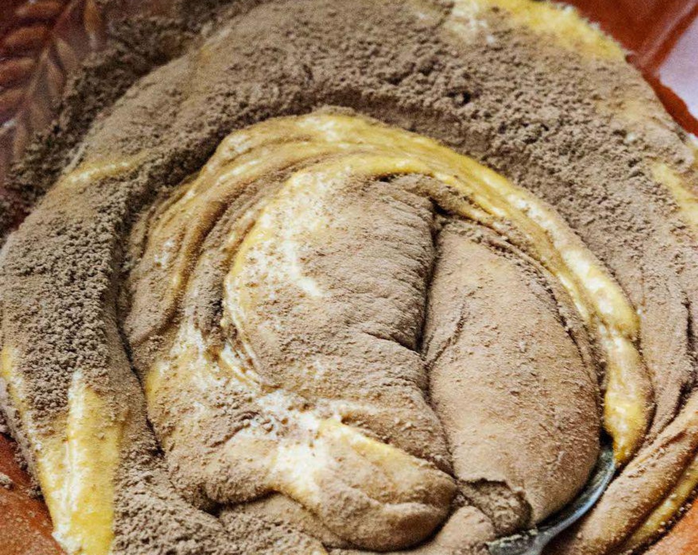 step 5 Divide the batter in half. Stir in the Cacao Powder (2 1/3 Tbsp) into one half, and fold in the Chocolate Chunks (1/2 cup) in the other half, saving a few for the top.