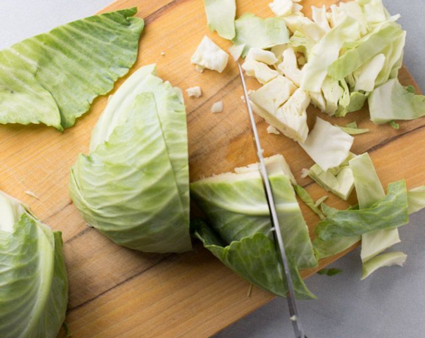 step 1 Chop the Green Cabbage (1 head) into about 1-inch chunks. Remove and discard the hard core.