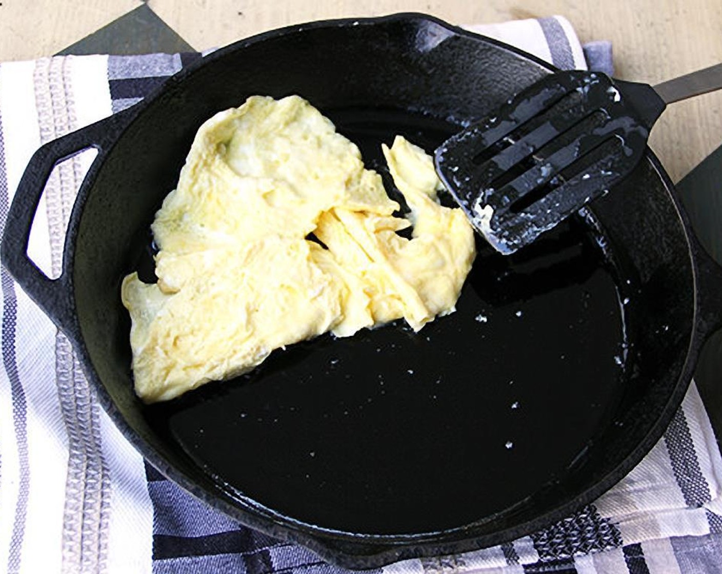 step 2 Let them cook for a few seconds, then gently push them to one side of the pan, tilting the pan to get uncooked egg to slide onto the pan and set. Cook just until the eggs are soft-cooked. Remove them to a small dish and set aside.