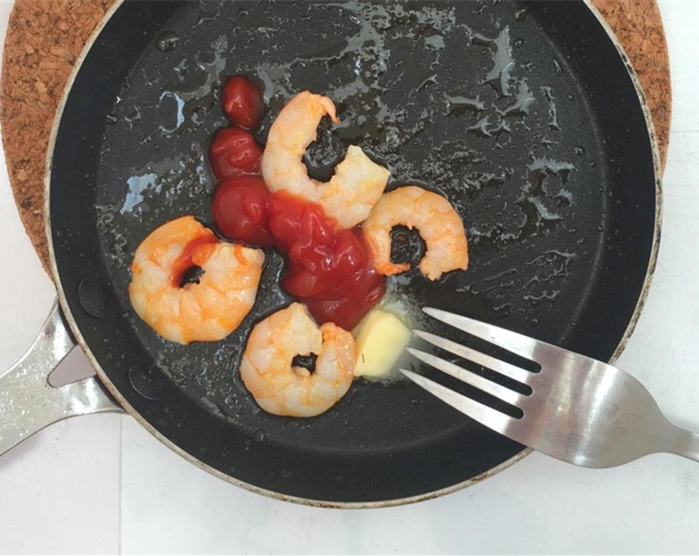 step 6 Quickly bake the shrimp on both sides for a minute until pink. Then add the Buffalo Sauce (1 Tbsp) and the rest of the Unsalted Butter (1 tsp).