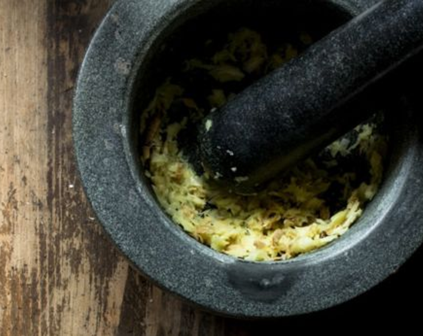 step 5 Using your preferred method (mortar and pestle, food processor, or finely chop by hand) chop the Garlic (2 cloves) and Fresh Ginger (4 slices) up as finely as you can and add it to the chicken.