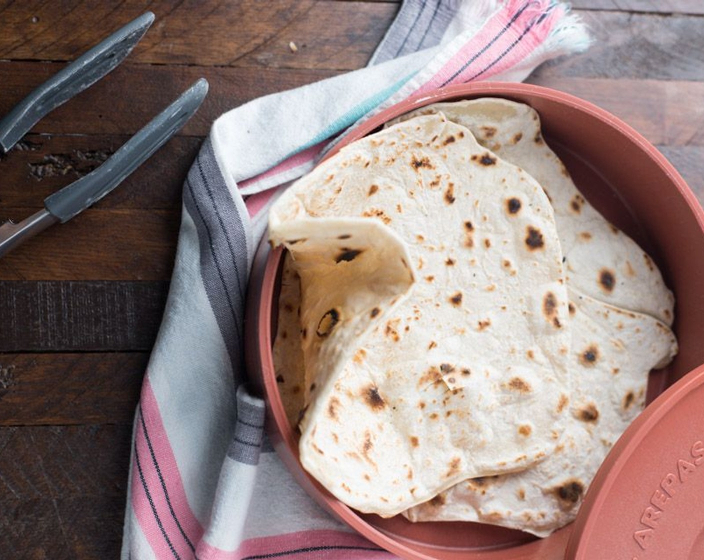 step 7 If not using tortillas within the hour, save tortillas in a sealed container in the refrigerator until ready to eat. Re-heat tortillas with a wet paper towel and microwave for 20 to 30 seconds.
