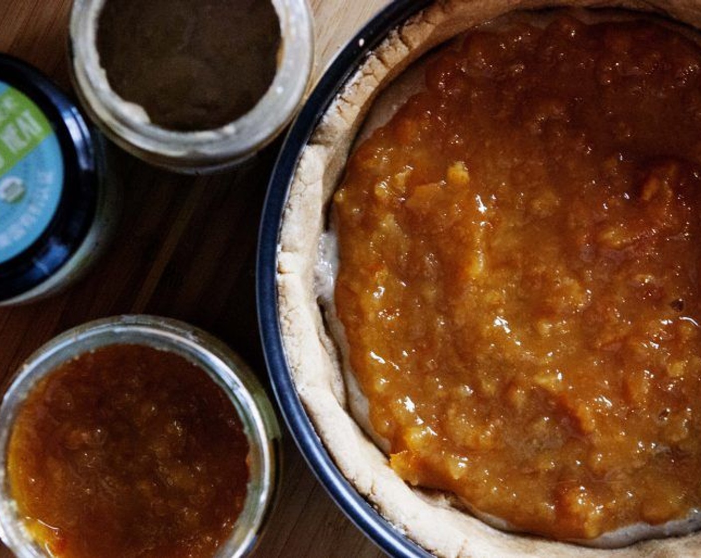 step 4 Grease and flour a pie crust pan. Roll out 2/3 of the dough into a thick circle and lay it inside the pie pan. Spread the Sunflower Seed Butter (3 Tbsp) and Orange Marmalade (3 Tbsp) over top.