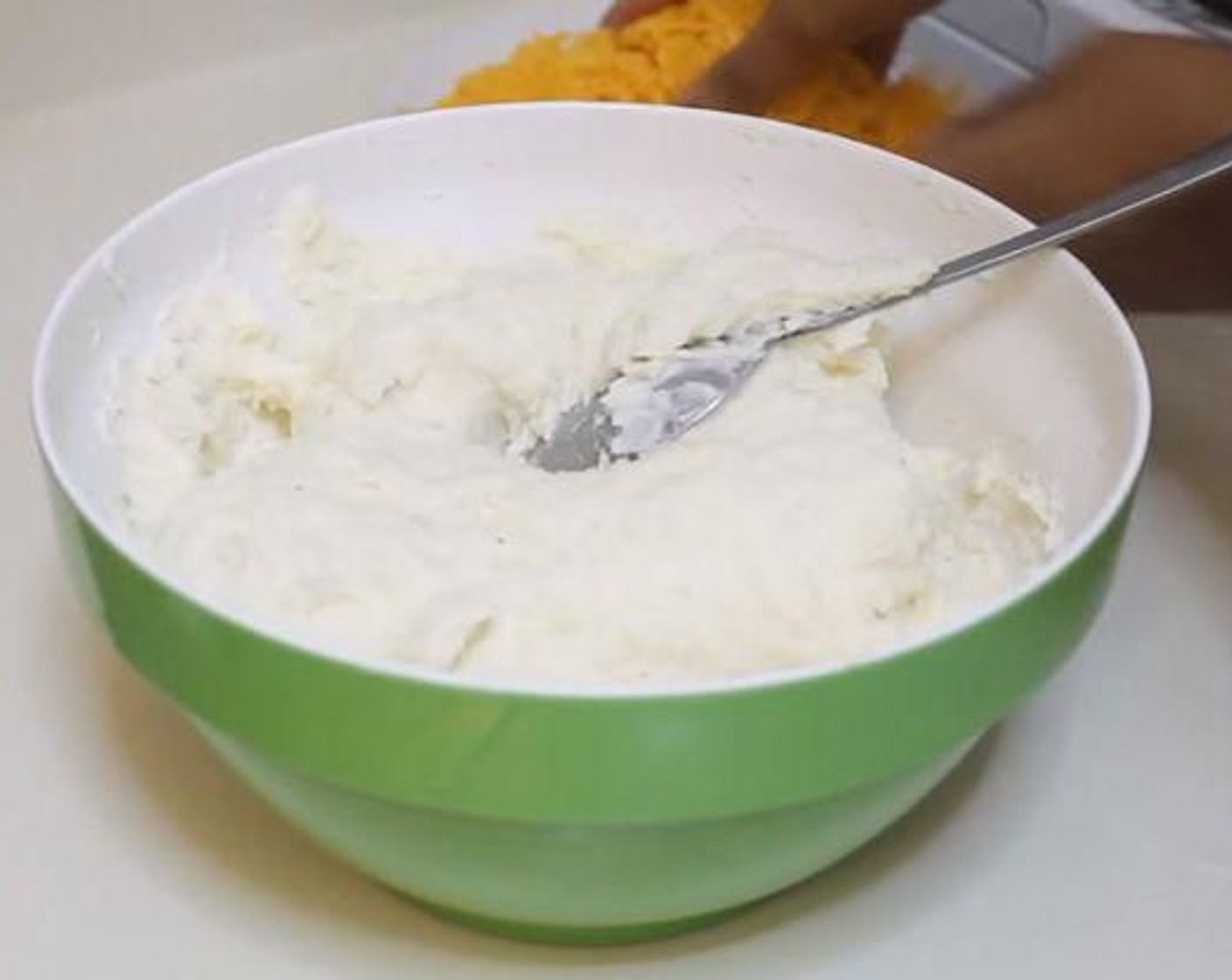 step 3 Melt together the Butter (4 Tbsp) and Milk (1/3 cup). Add to the scooped out potato and mash. Add the Simply Organic Onion Powder (1 tsp), Simply Organic Garlic Powder (1 tsp), Sour Cream (2/3 cup), Salt (to taste), and Ground Black Pepper (to taste) and mix well. Add in some of the Sharp Cheddar Cheese (3/4 cup).