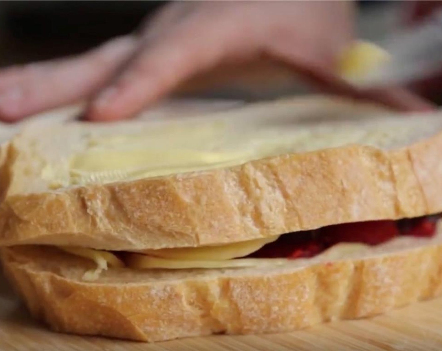 step 7 Place second slice of bread on top and spread with Unsalted Butter (1/2 Tbsp)