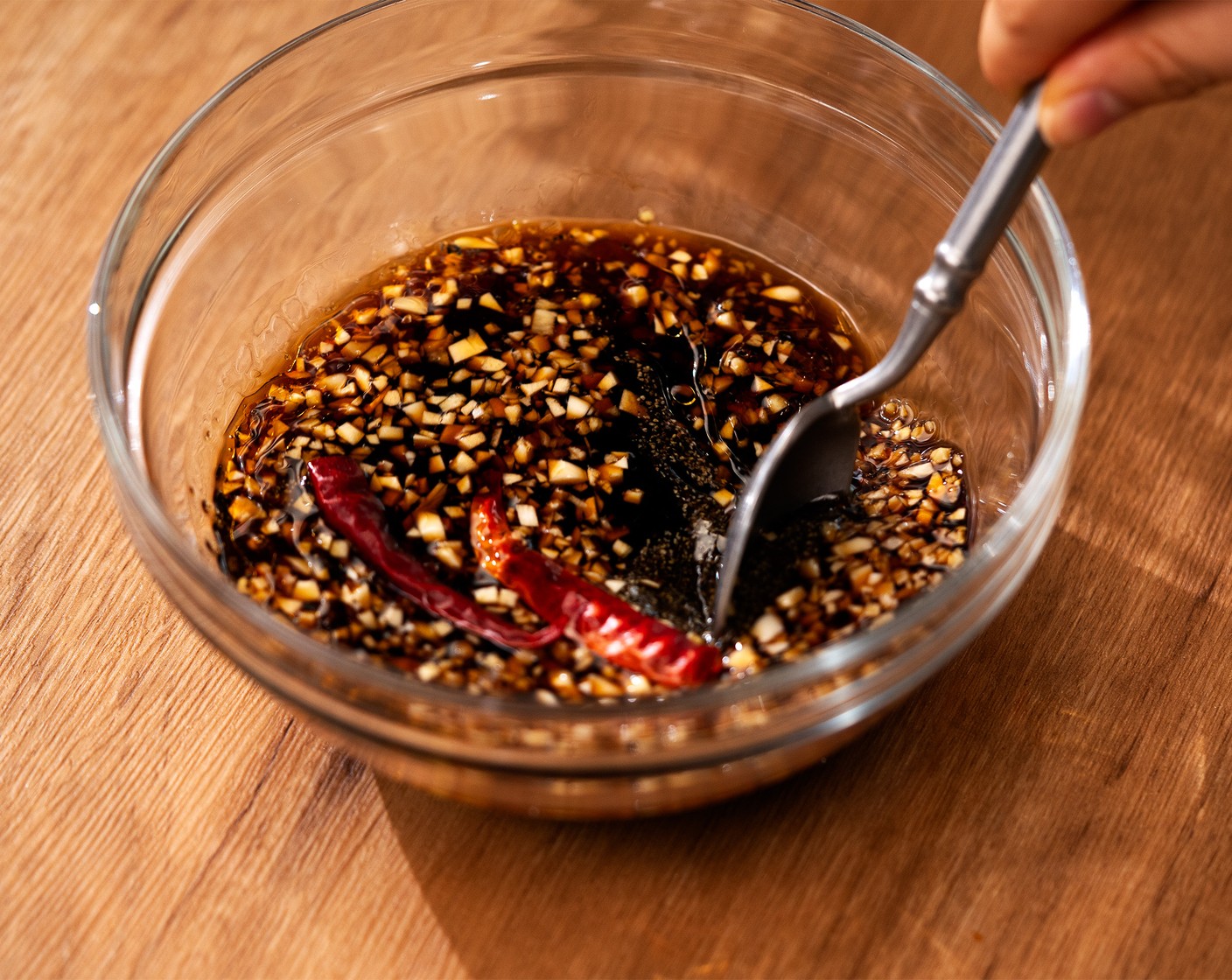 step 2 In a medium mixing bowl, add Soy Sauce (1/2 cup), Brown Sugar (3 Tbsp), Mirin (1/4 cup), Garlic (1/4 cup), Fresh Ginger (1 tsp), Sesame Oil (1 Tbsp), Ground Black Pepper (1 tsp), and Dried Chili Peppers (2). Mix all the ingredients until well combined, and set aside.