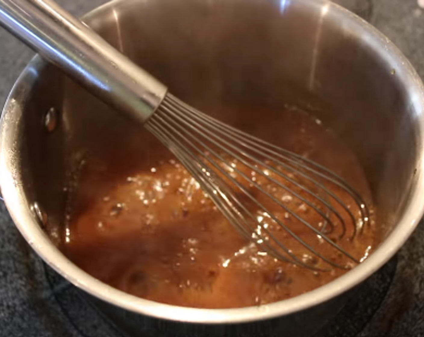 step 4 While ham is smoking, mix up your Maple Glaze by combining Maple Syrup (1/4 cup), Dark Brown Sugar (1/4 cup), Brown Sugar (1/4 cup), Honey Dijon Mustard (2 Tbsp) and Apple Juice (2 Tbsp) over medium heat. Bring the mixture to a simmer and reduce until it thickens.