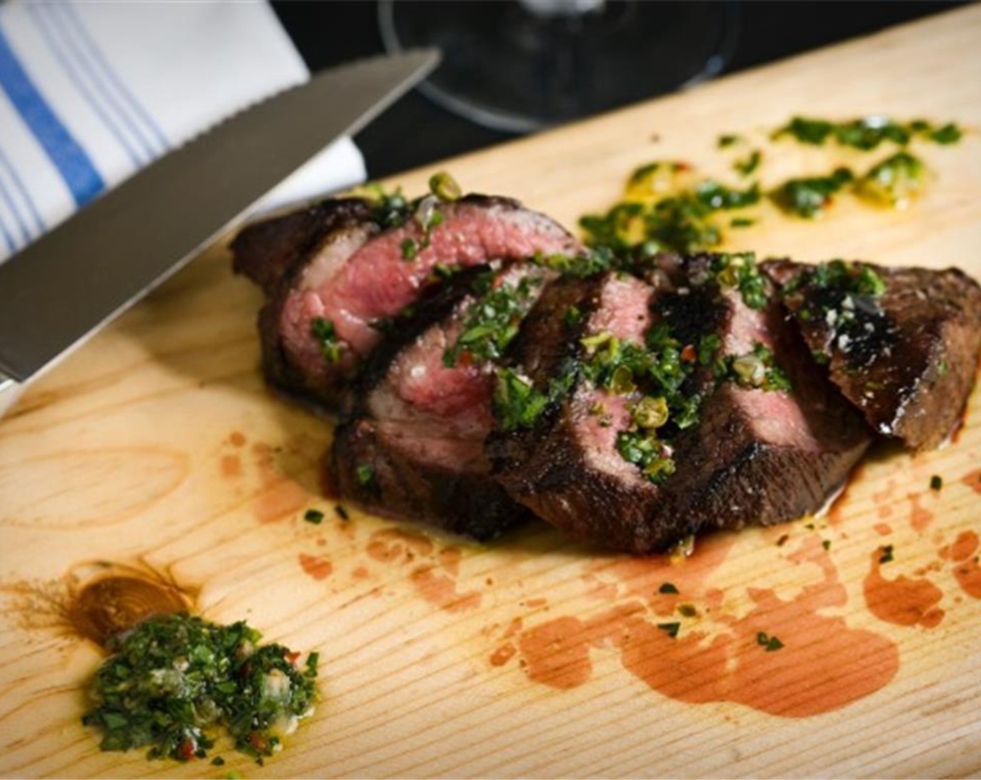 step 8 Transfer the steak to a carving board. Rub a generous amount of the chimichurri into both sides of the steak and let it rest 5 to 10 minutes before carving. If desired, serve with my preserved lemon chimichurri sauce from SideChef.