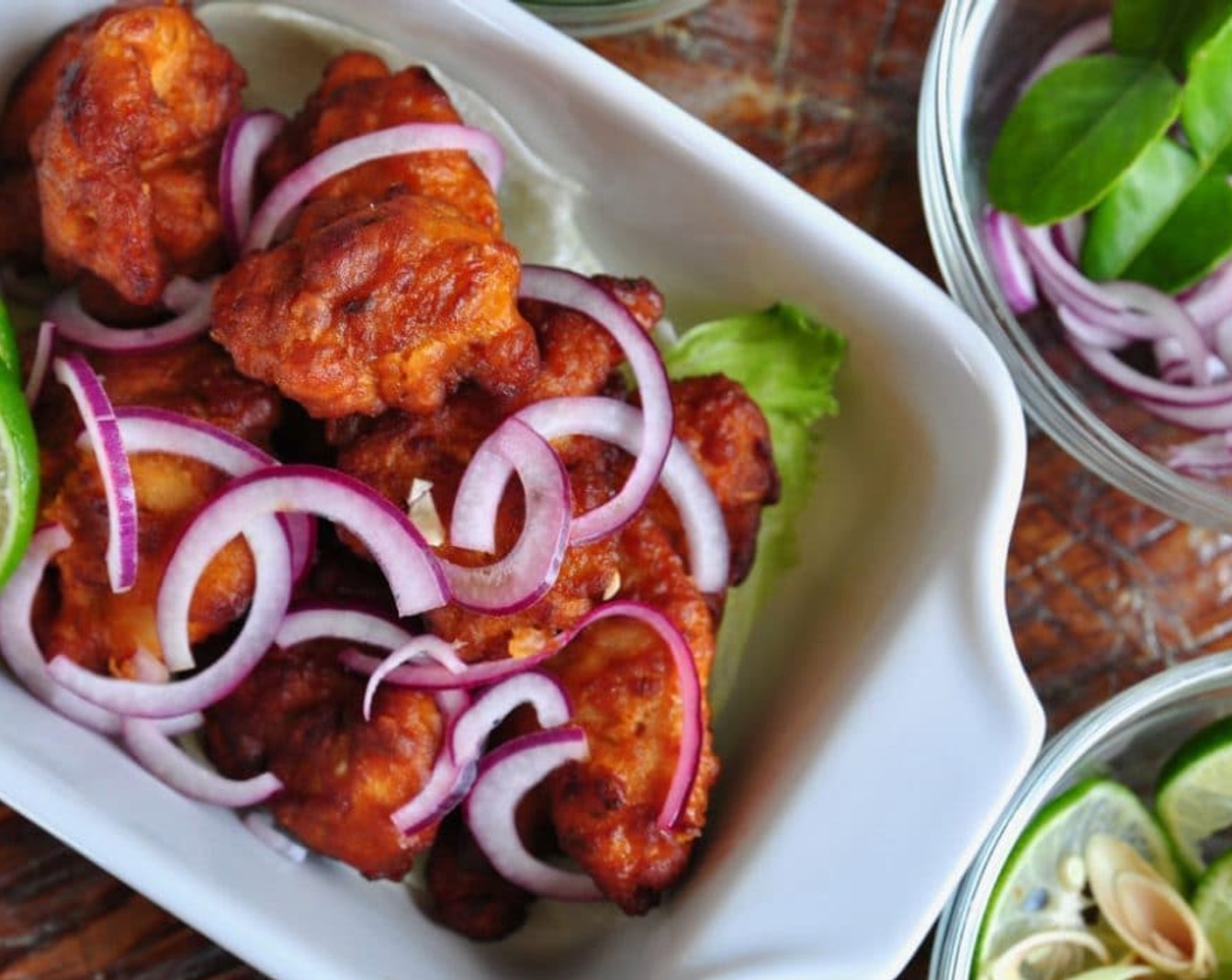 step 5 Place the fried chicken on a serving plate with steamed rice. Garnish with Onion (1) and top with the juice of a Lime (1). Enjoy!