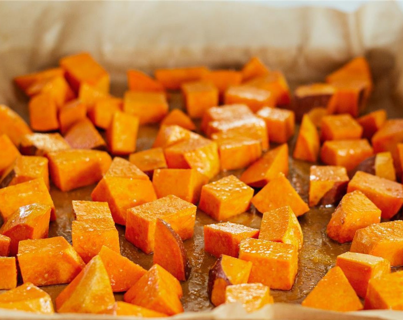 step 3 Line a sheet pan with parchment paper. Toss the sweet potatoes on the parchment paper with Coconut Oil (1 Tbsp), Brown Sugar (1 Tbsp), and a sprinkle of Salt (to taste) and Ground Black Pepper (to taste). Transfer to the oven to roast for an hour, flipping halfway through.