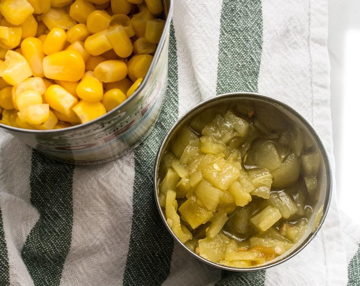 step 3 Once the zucchini and squash are cooked, stir in Whole Kernel Corn (1 can), Mild Diced Green Chiles (1 can), Salt (1 tsp) and Ground Black Pepper (3/4 tsp) and cook 2-3 minutes or until corn is heated through.