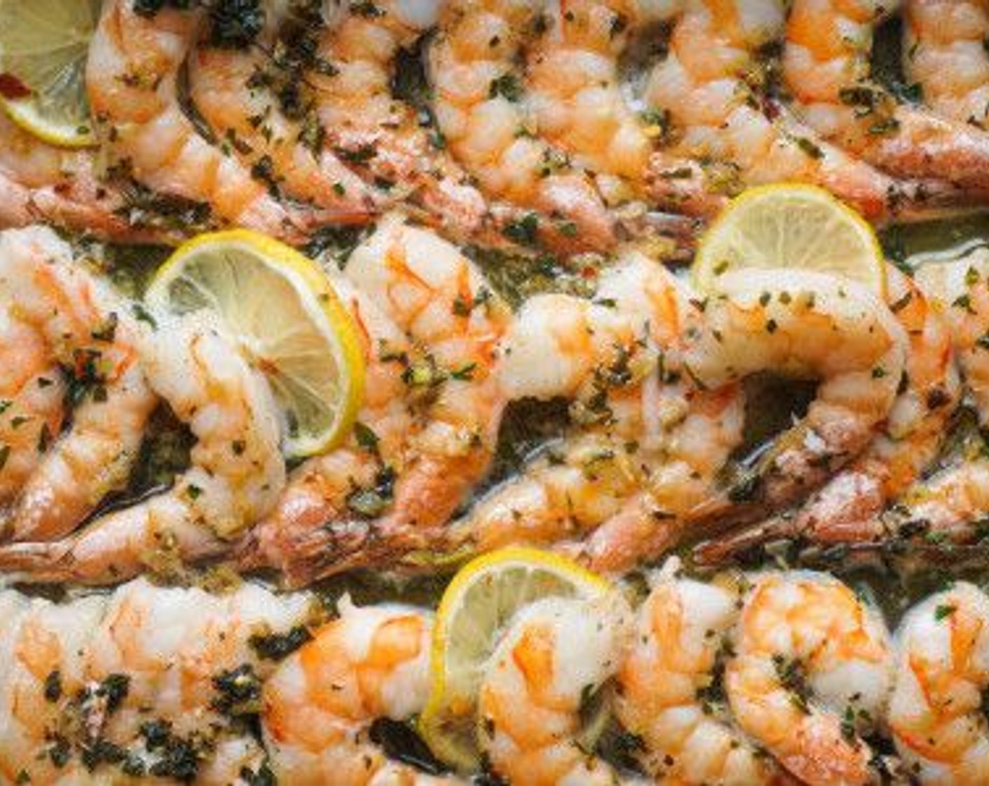 step 6 Drizzle the butter sauce evenly over the shrimp and bake for 8 minutes until pink.