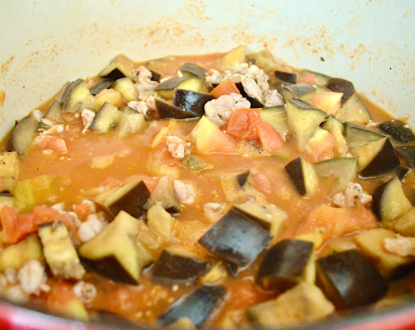 step 3 Add Garlic (6 cloves) and the chicken sausage. Season the mixture generously with Salt (2 pinches) and Crushed Red Pepper Flakes (2 pinches). Stir well, and let it simmer on medium-low heat for about 1 hour.