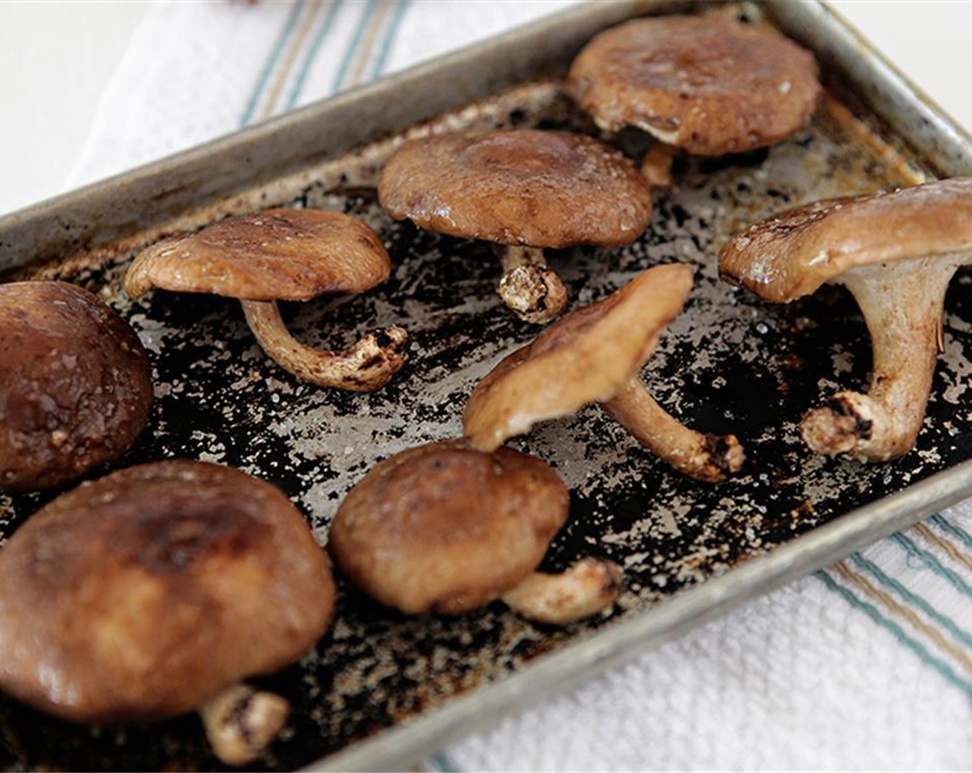 step 4 Mix and put on a small roasting pan, reserve bowl for later use. Cook in the oven for 10-11 min, remove from oven, place mushrooms and the liquid from the mushrooms cooking in a small bowl and allow to cool. Turn oven down to 325 degrees F (160 degrees C).