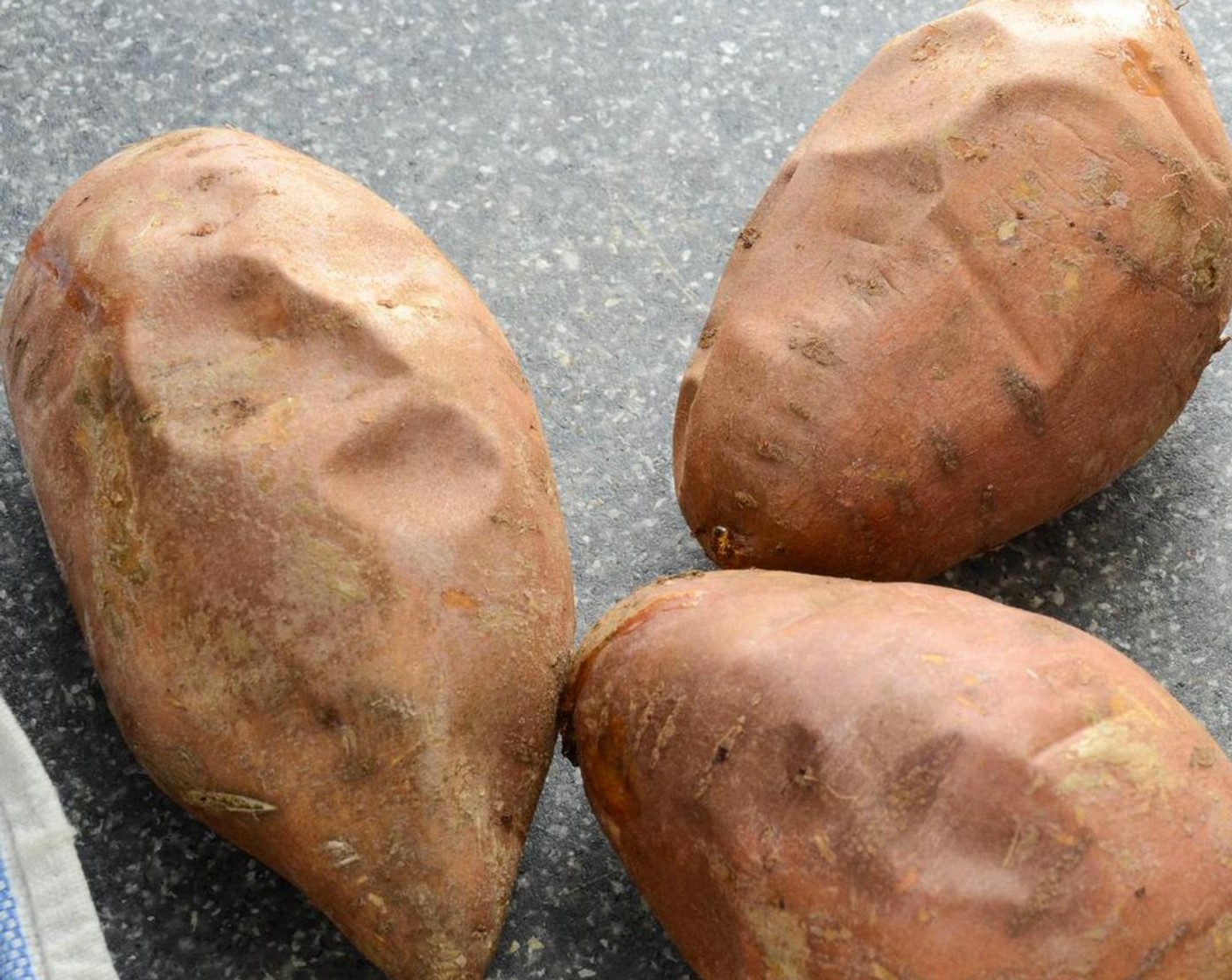 step 2 Place the Sweet Potatoes (1.5 lb) on a baking sheet lined with aluminum foil and bake for 45 minutes to an hour - or until potatoes are cooked through.