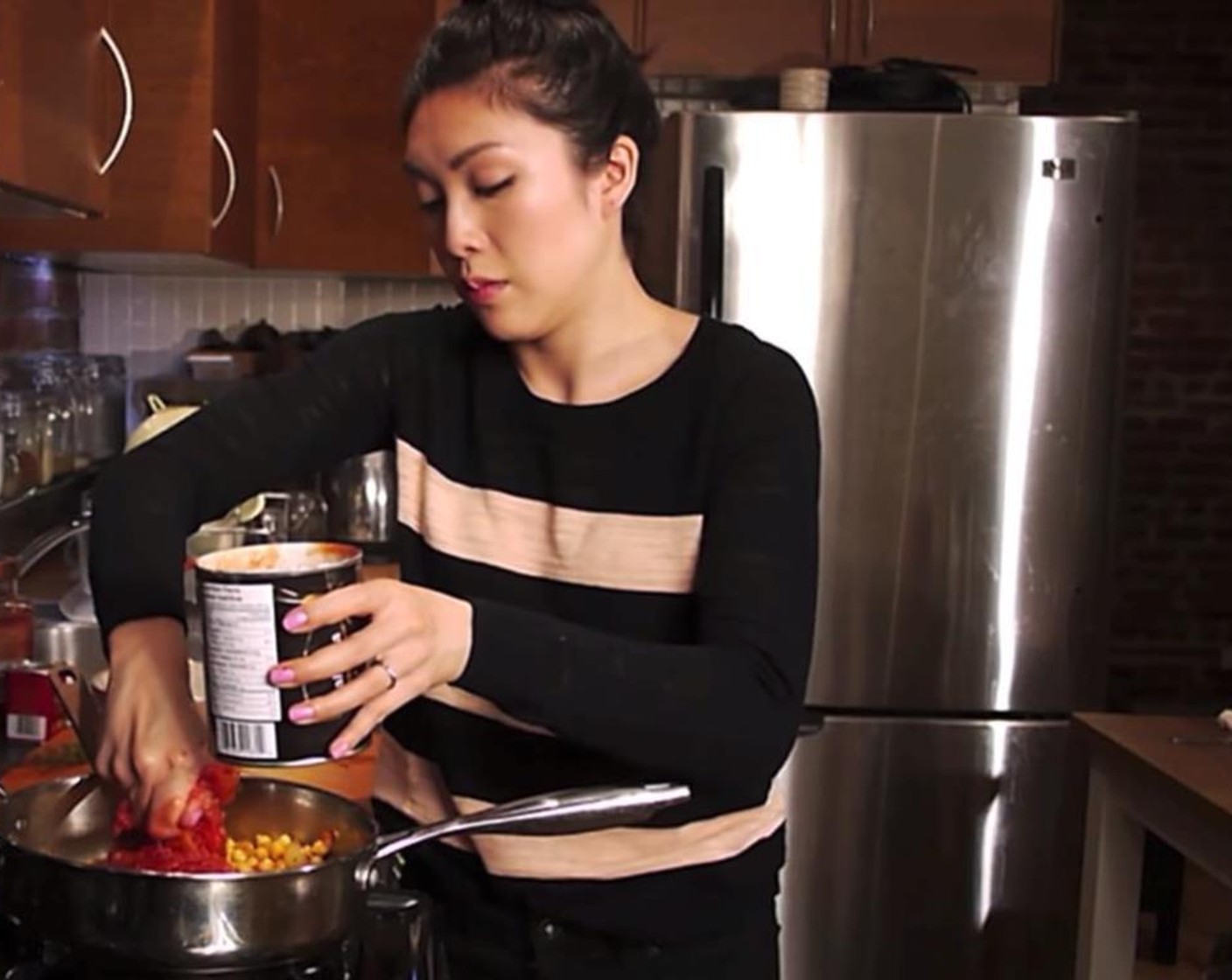 step 9 Add GOYA® Chick Peas (2 cups) and Tomato (1 cup). Squish the tomatoes with your hands while pouring to get the required texture.