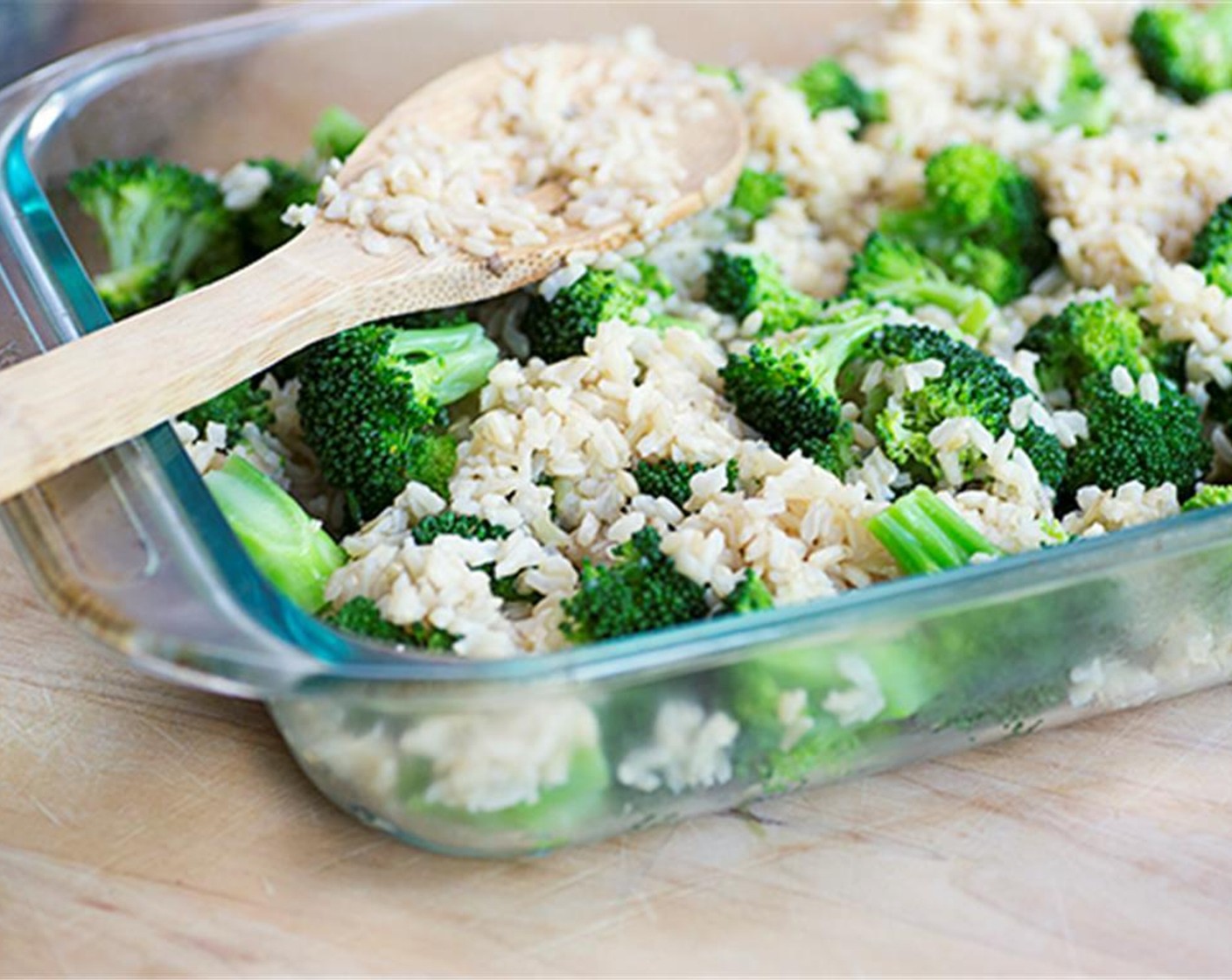 step 9 Mix together the rice and broccoli and place in a 3-quart baking dish. Next, scoop out veggie mixture and spoon it evenly over the top of rice.