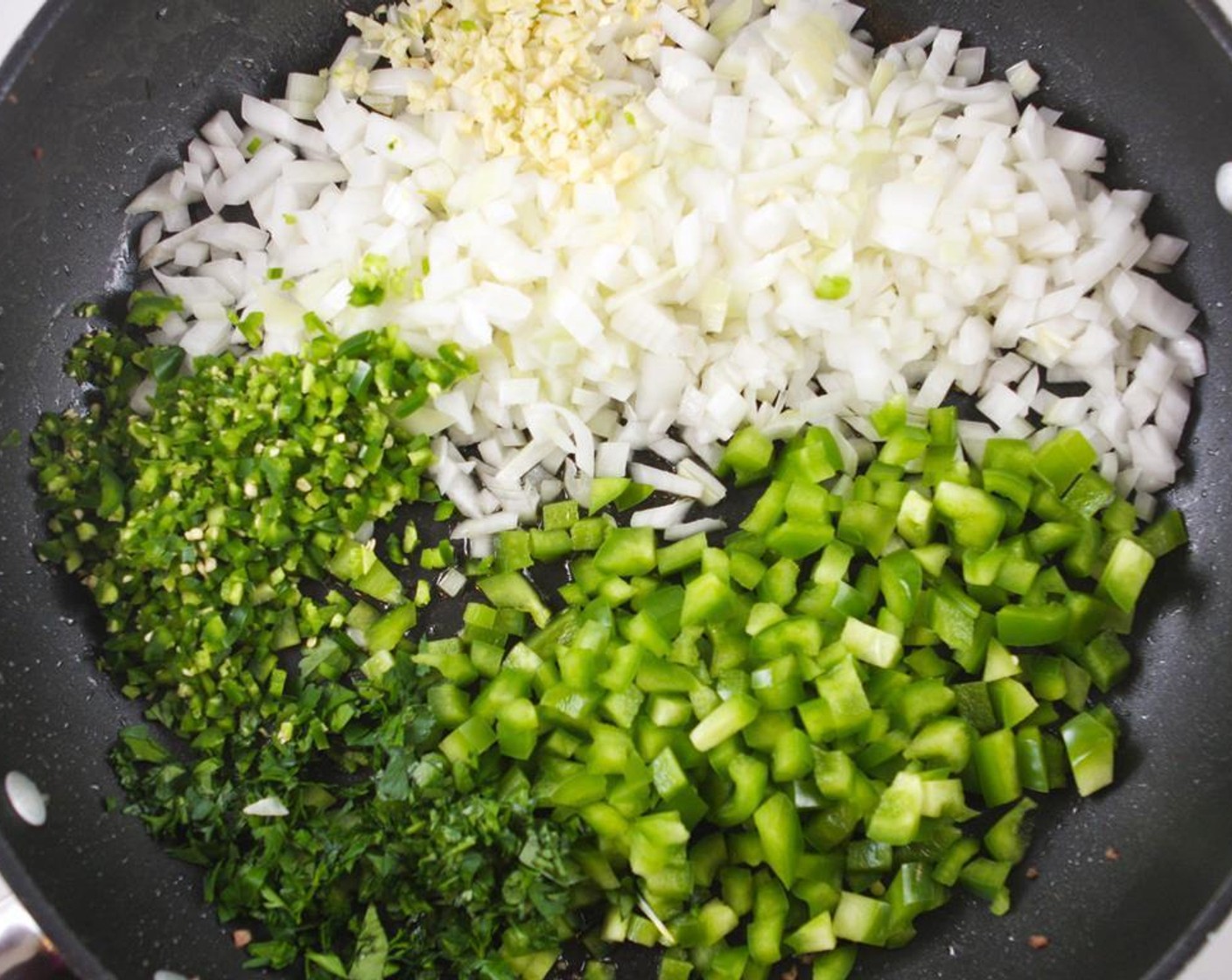 step 2 Add the Extra-Virgin Olive Oil (1/4 cup) to the skillet. Add the Yellow Onion (1), Green Bell Pepper (1), Garlic (4 cloves), Italian Flat-Leaf Parsley (1/4 cup) and Jalapeño Peppers (2) (if using) and cook over medium heat, stirring occasionally, until onions are soft and fragrant (about 5 minutes).