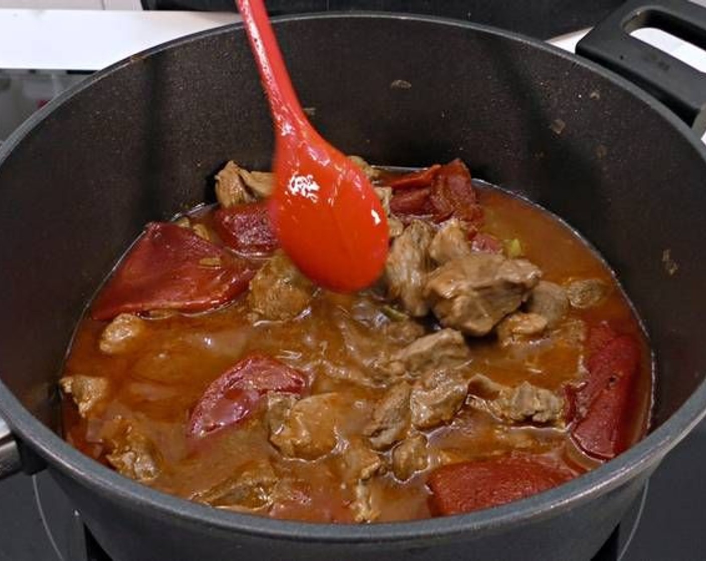 step 5 Once you test the meat with a fork and its tender, add the Jarred Diced Pimientos (12 pieces). Continue to cook for another 15 minutes.