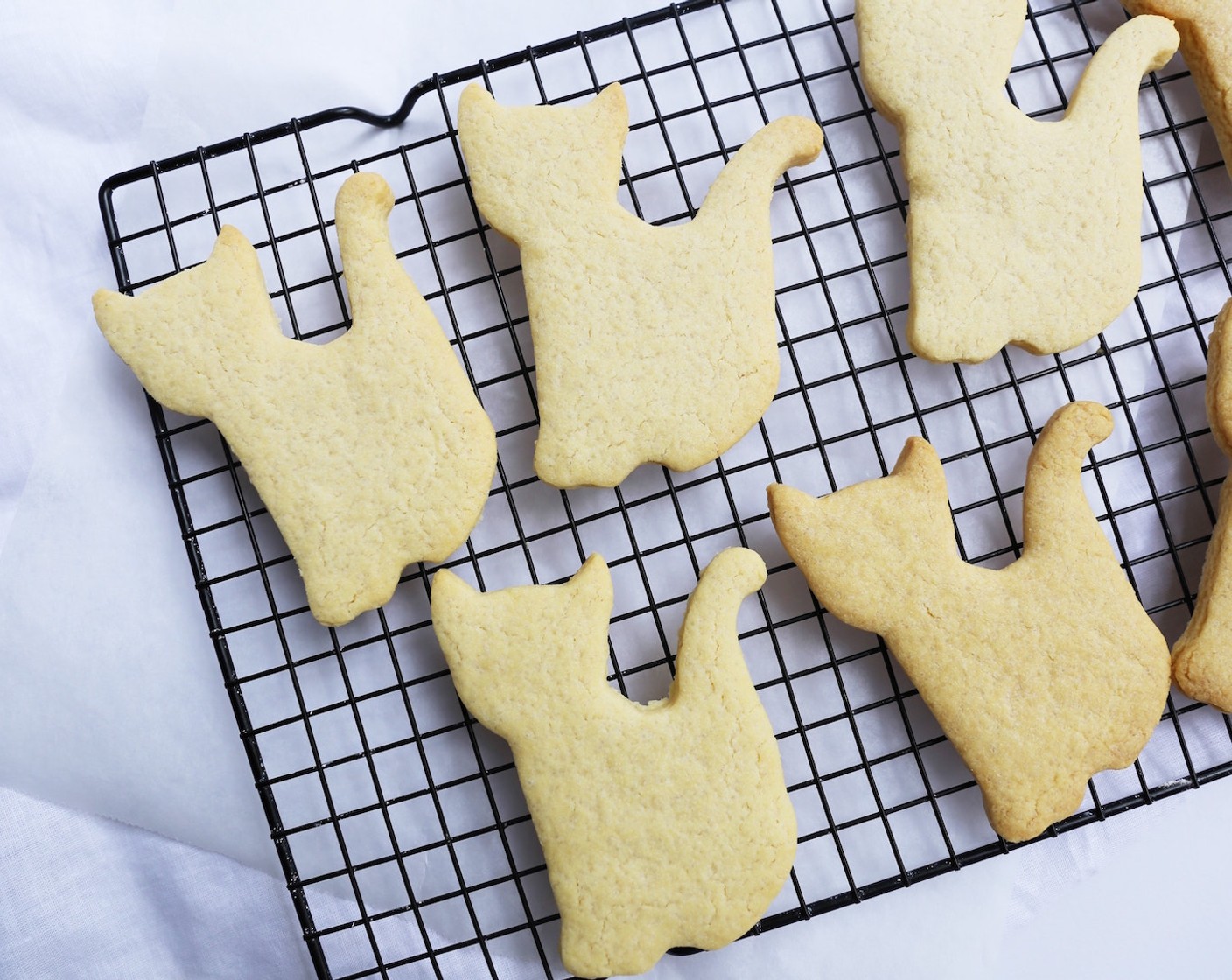 step 8 Let the Vanilla Sugar Cookies cool for a few minutes before transferring them to a cooling rack. Cool completely before decorating or eat as is. Serve and enjoy!