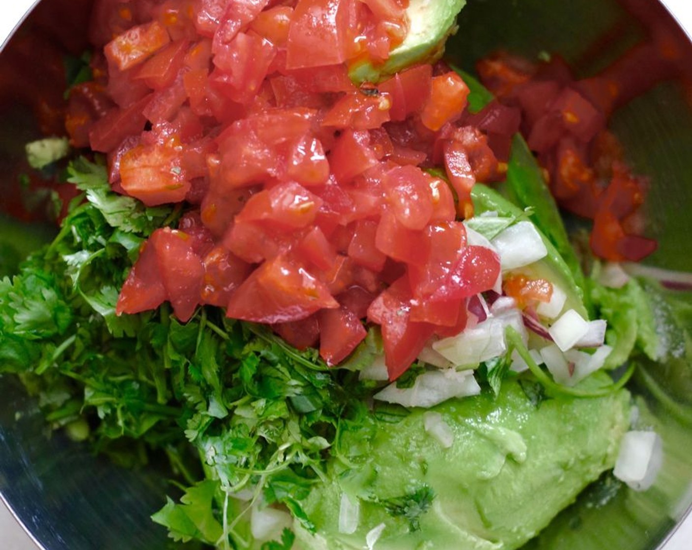 step 1 In a medium sized bowl, smash the Avocados (4) with the Fresh Cilantro (1/2 cup), Salt (1/2 tsp), Red Onion (3/4), Lime Wedges (3), and Tomato (3/4 cup). Add Jalapeño Peppers (to taste), if using.