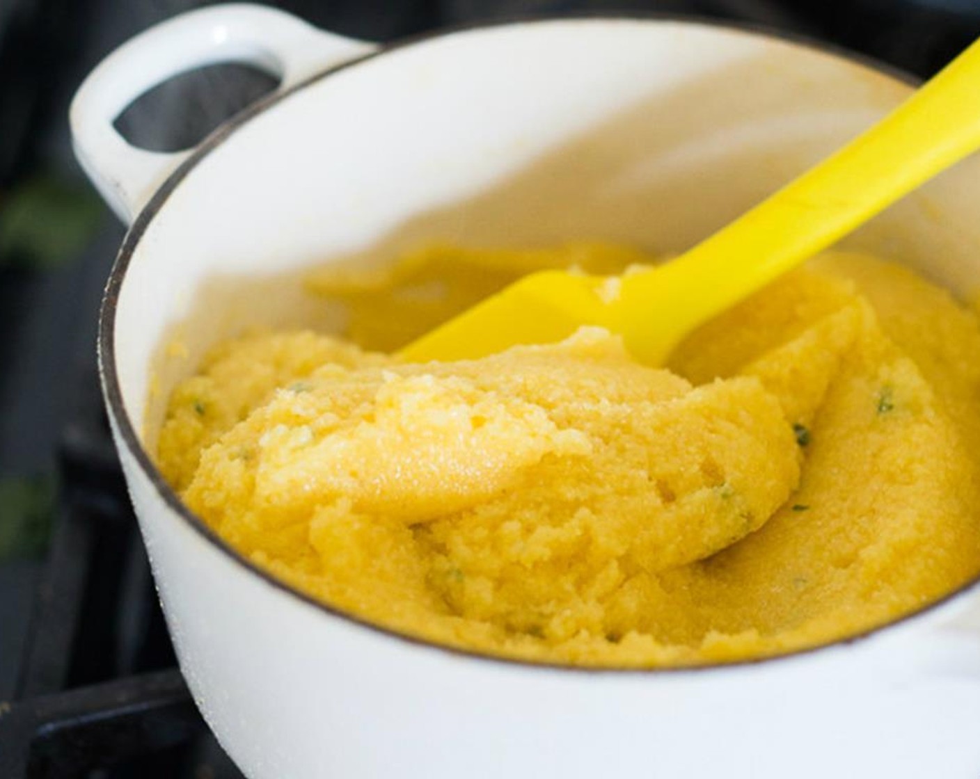 step 8 Once polenta has cooked and thickened, whisk in Olive Oil (2 Tbsp) and Fresh Sage (1 Tbsp).