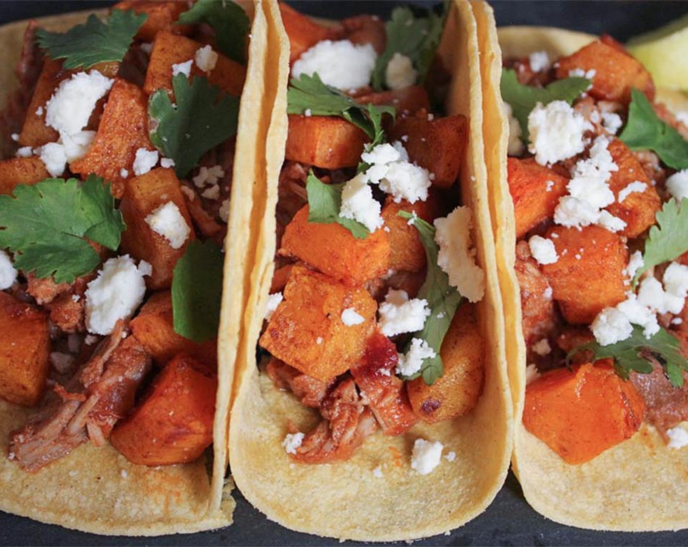 step 13 Top each tortilla with your chipotle pork and butternut squash. Garnish with fresh cilantro, a generous sprinkling of queso fresco, and fresh lime wedges. Enjoy!