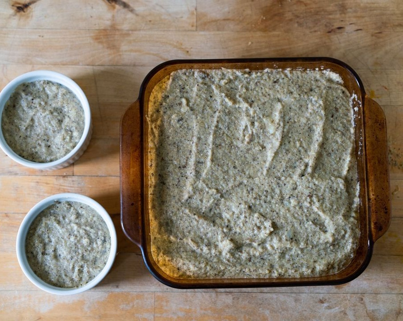 step 10 Fill with the cauliflower mixture. Each ramekin should hold a little under 1 cup of the filling. Tap the bottoms of the ramekins or baking dish against the counter so that the top of the kugel flattens out and you’ve released any air bubbles.