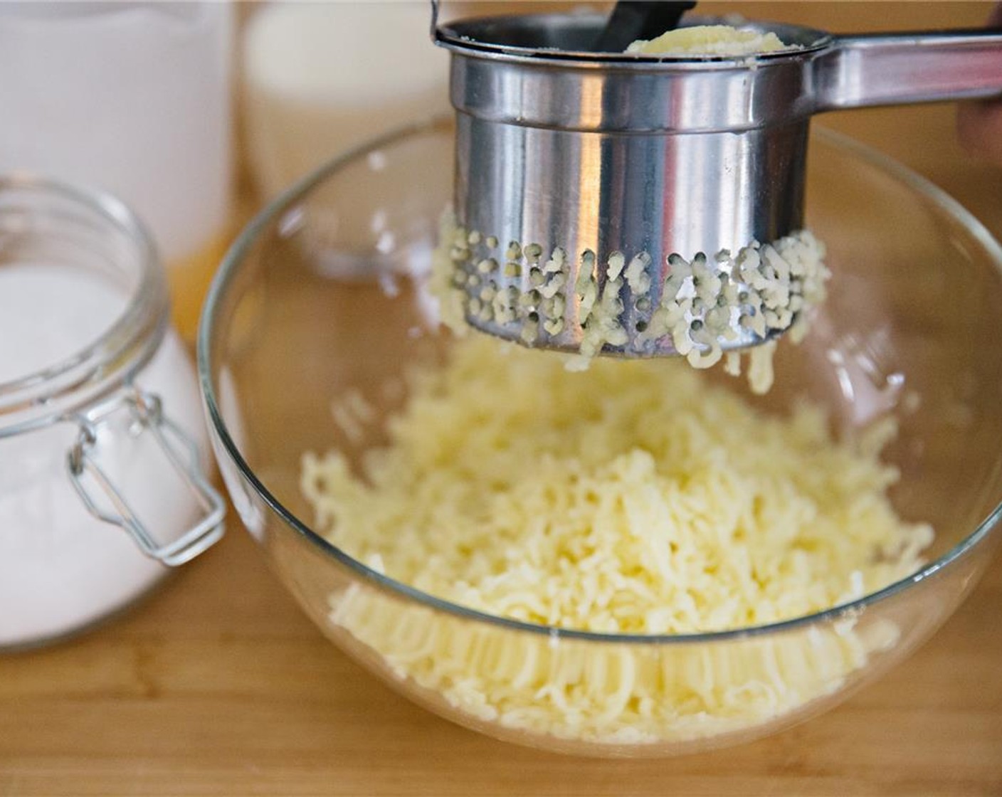 step 4 While still hot, mash the potatoes with a potato masher or ricer.